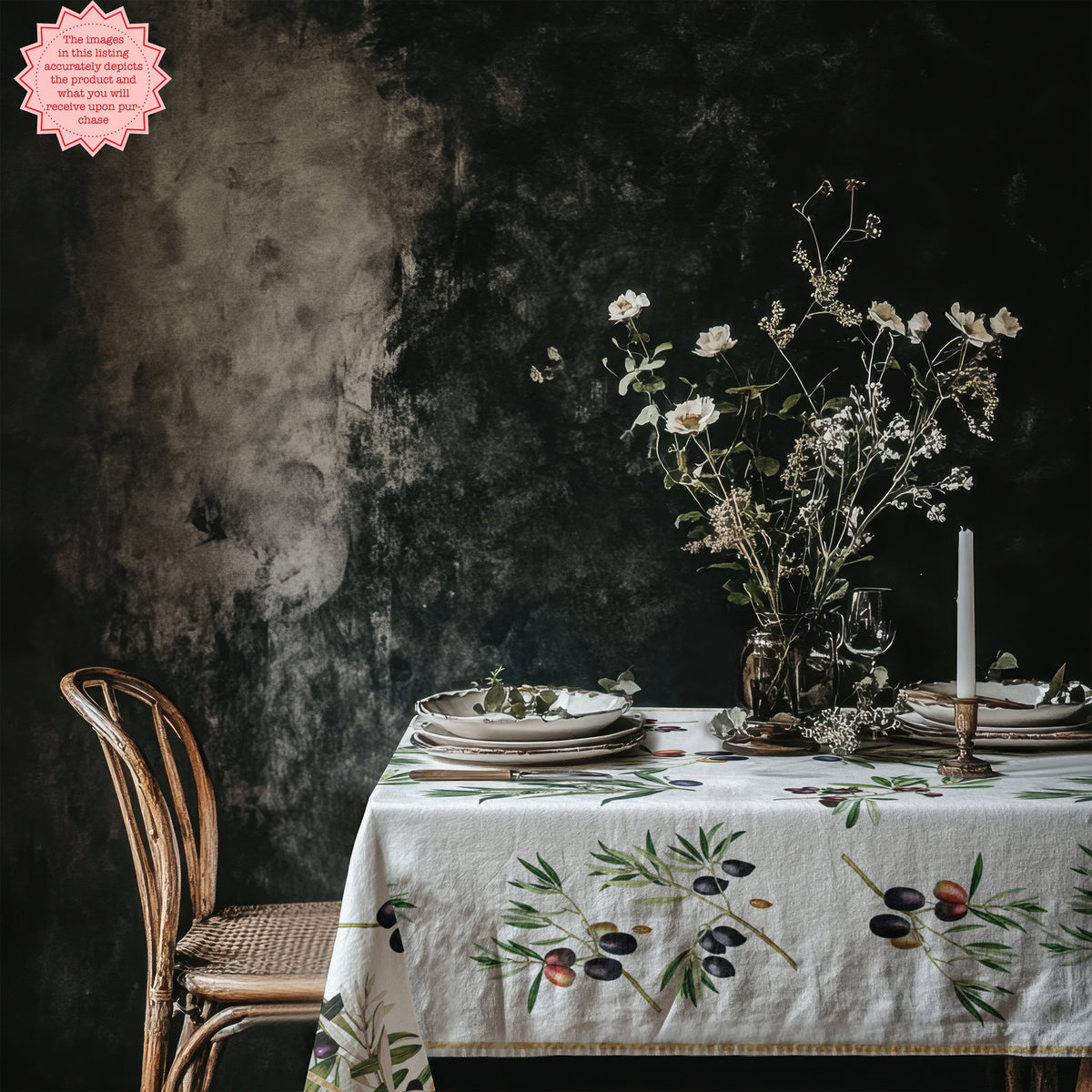 Olive branch tablecloth on a minimalist Mediterranean dining table.