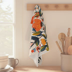 Mediterranean-inspired floral tea towel styled with wooden utensils and fresh flowers for elegant botanical kitchen décor.
