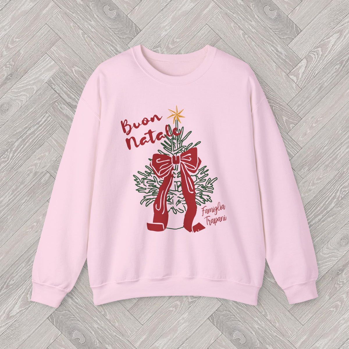 Detailed Italian Christmas illustration on a cosy sweatshirt featuring Buon Natale lettering, a golden star and traditional red and green festive colours.
