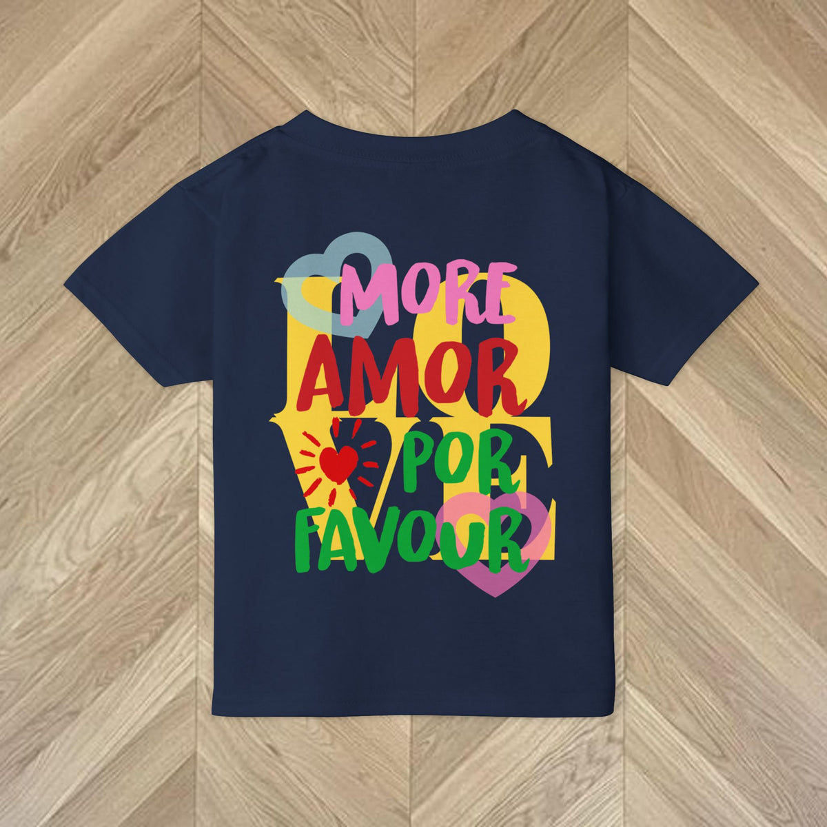 Detail of the Navy Gildan 5100P kids' T-shirt featuring the colourful More Amore Por Favour graphic design.