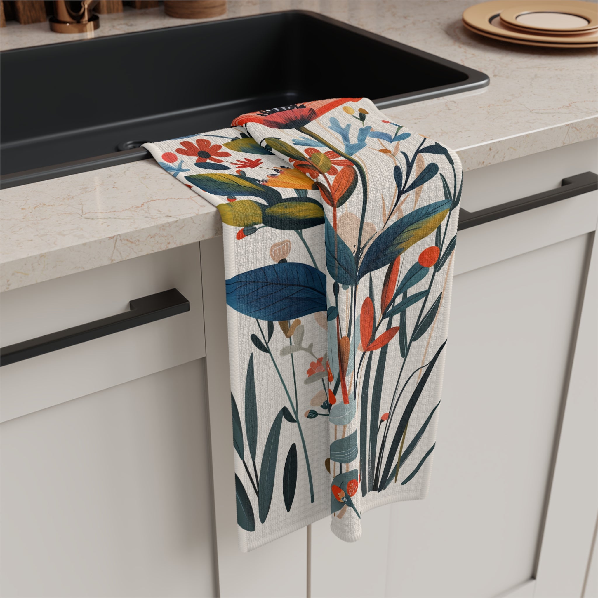 Decorative microfiber kitchen tea towel featuring hand-painted style wildflowers in warm Mediterranean colours on a cream background.