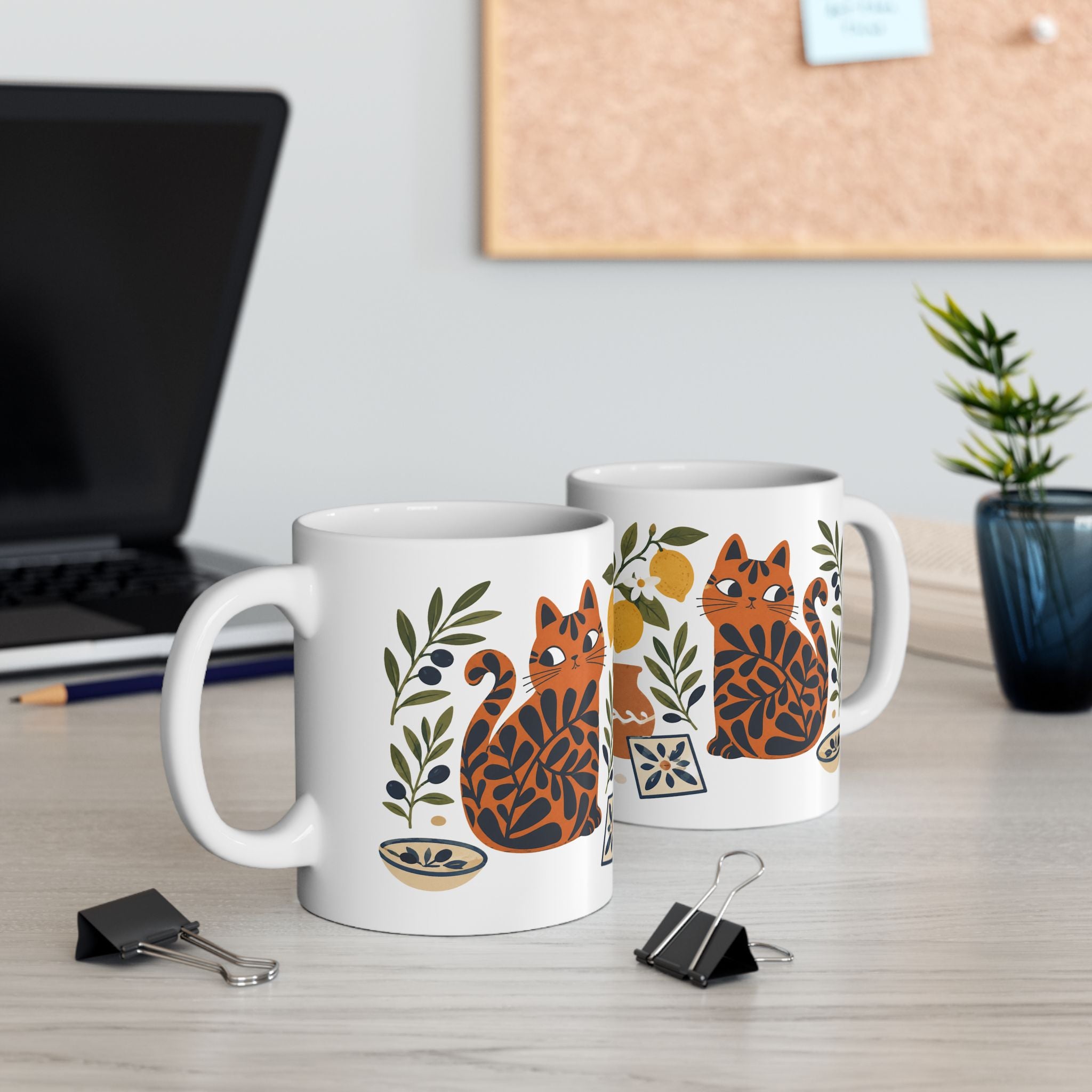 Mediterranean coffee mug with whimsical orange cat artwork inspired by coastal European living.