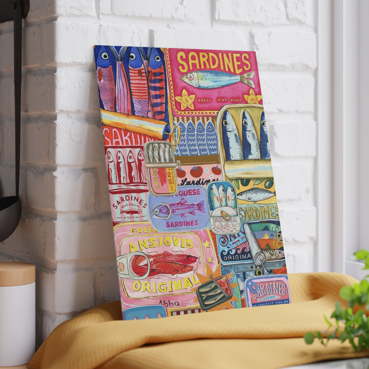Colourful Mediterranean sardines glass cutting board displayed as coastal kitchen decor
