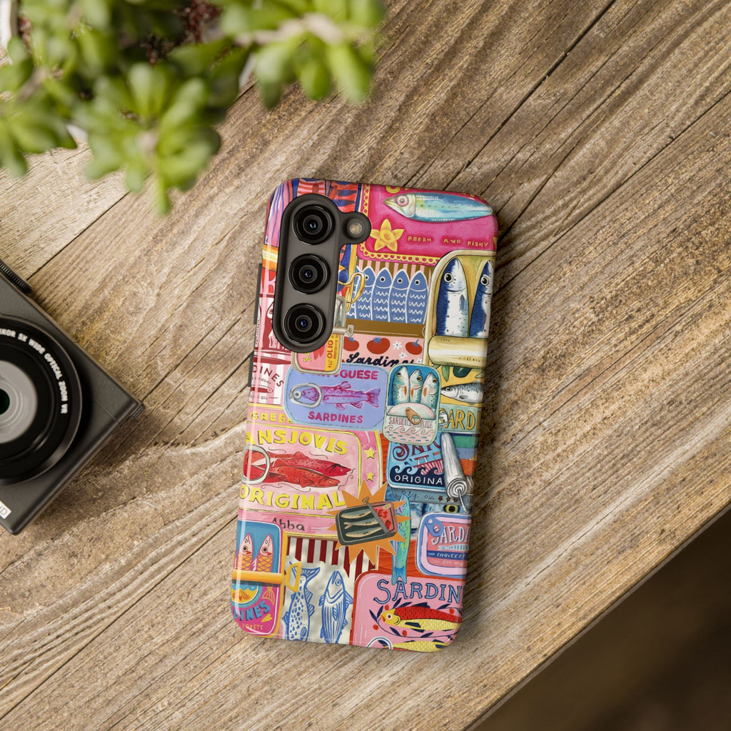 Tough coastal phone case with vibrant sardine tin illustrations inspired by Mediterranean summers, seafood markets, and nautical fisherman style.