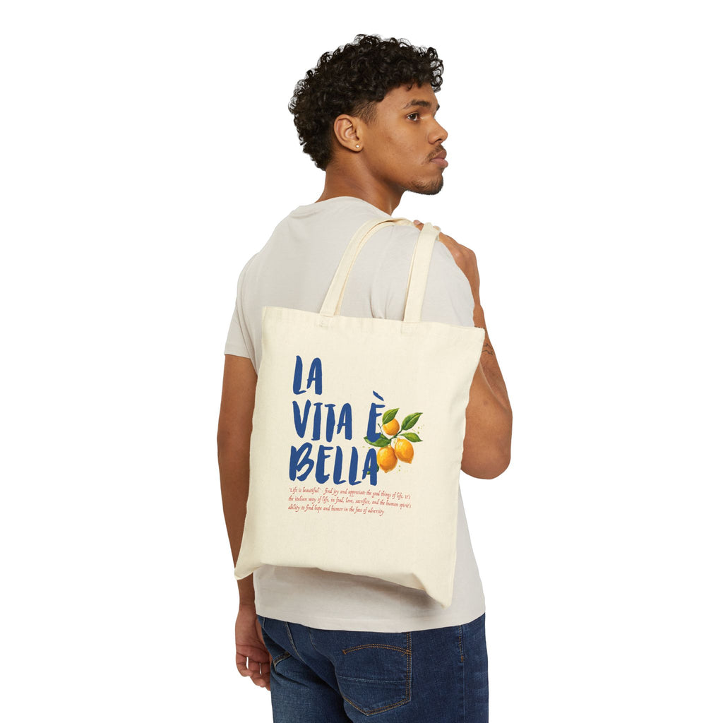 Close-up of Italian lemon artwork on premium cotton canvas tote bag with bold La Vita è Bella lettering.