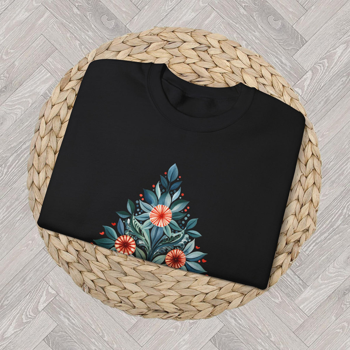 Close up Black Christmas crewneck featuring a Mediterranean-inspired folk-art Christmas tree.