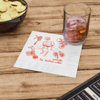 Personalized summer wedding napkin displayed at a cocktail bar with an Italian-inspired design and custom event information.