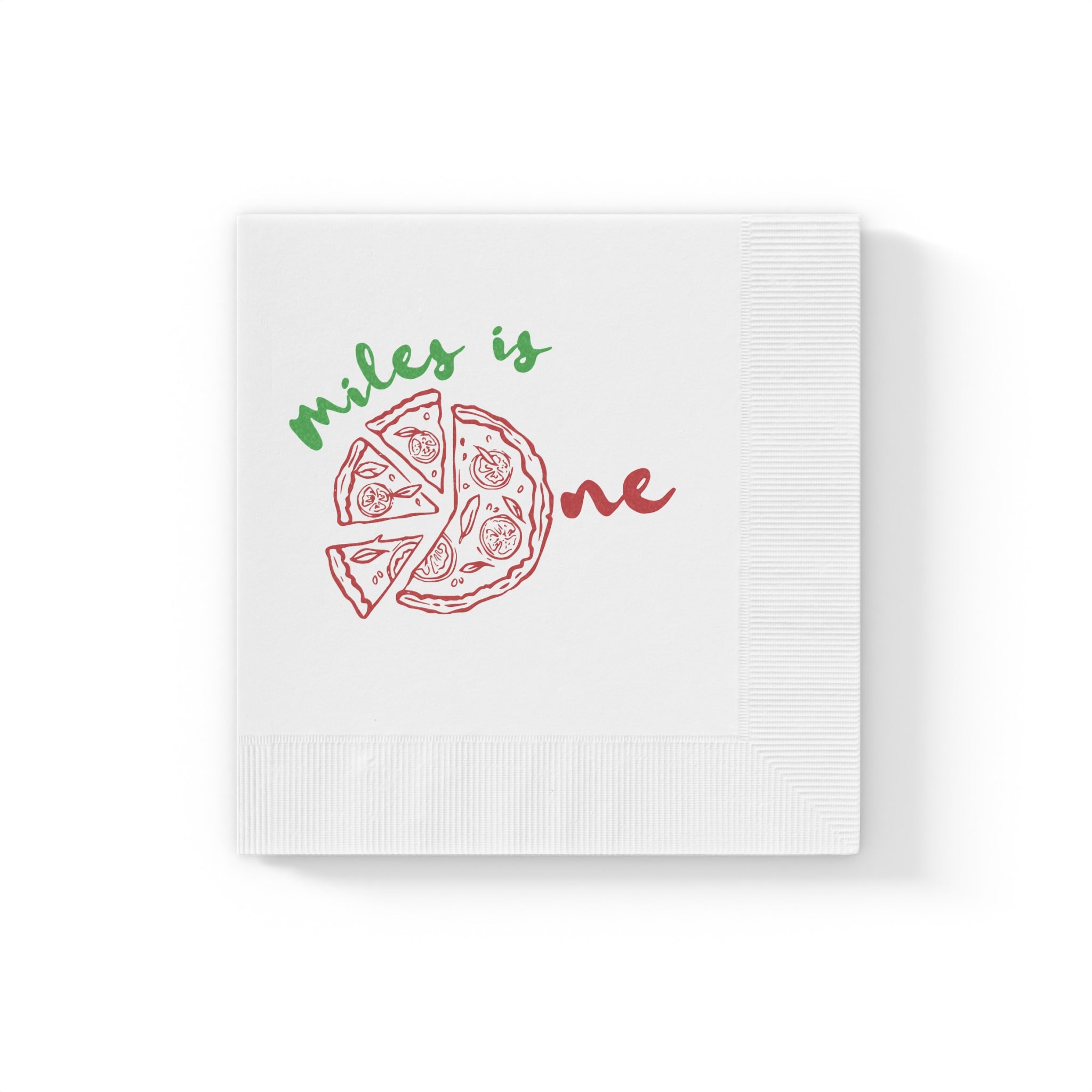Close-up of a custom first birthday pizza napkin printed on premium white three-ply paper with elegant coined edges.