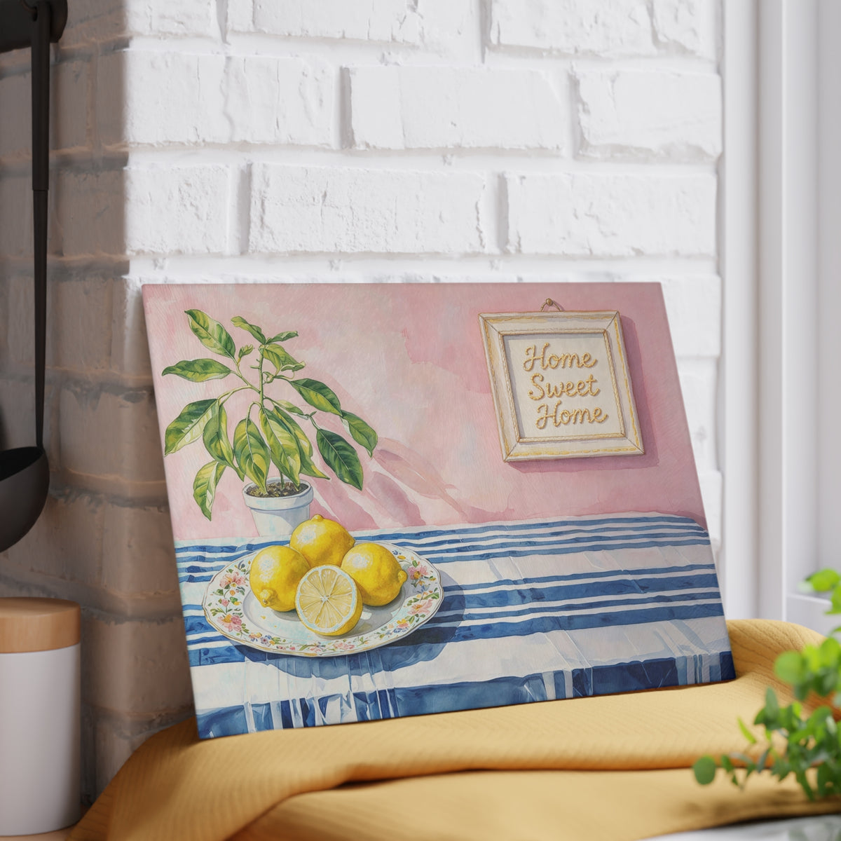 Rebbella lemon glass cutting board featuring artistic watercolor fruit, green botanical leaves and classic blue stripes.
