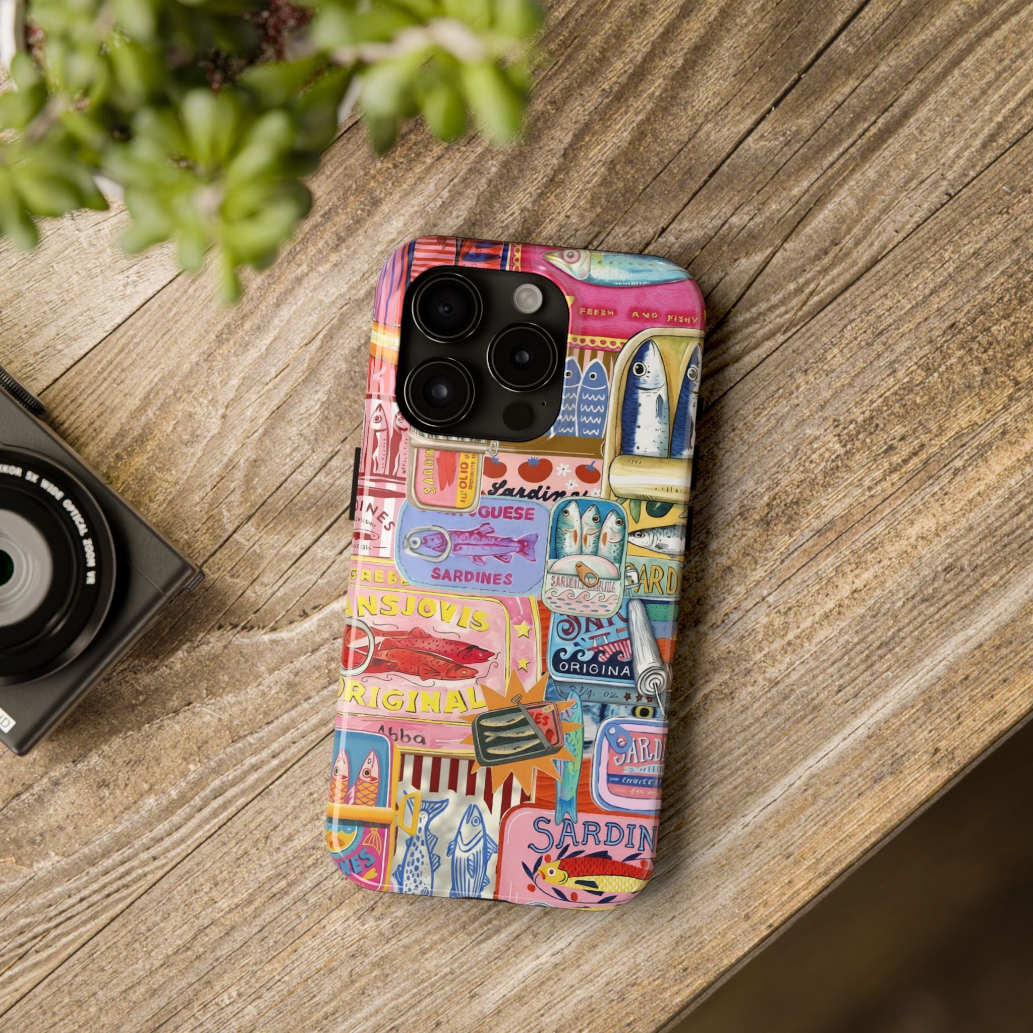 Colorful Mediterranean sardines phone case featuring vintage fish tin illustrations and fisherman aesthetic artwork for iPhone and Samsung devices.