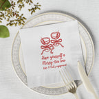 White three-ply Christmas martini napkin with personalized name and date, styled for an elegant holiday cocktail celebration.