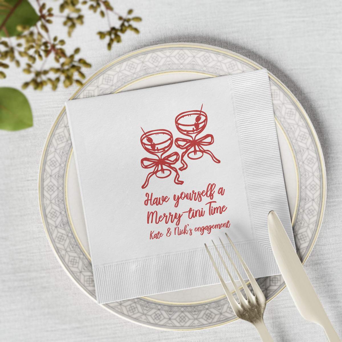 White three-ply Christmas martini napkin with personalized name and date, styled for an elegant holiday cocktail celebration.