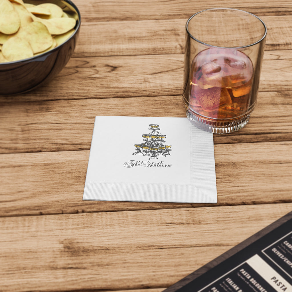 Close-up of a premium white coined-edge Champagne Social Club napkin with a custom name and event date.