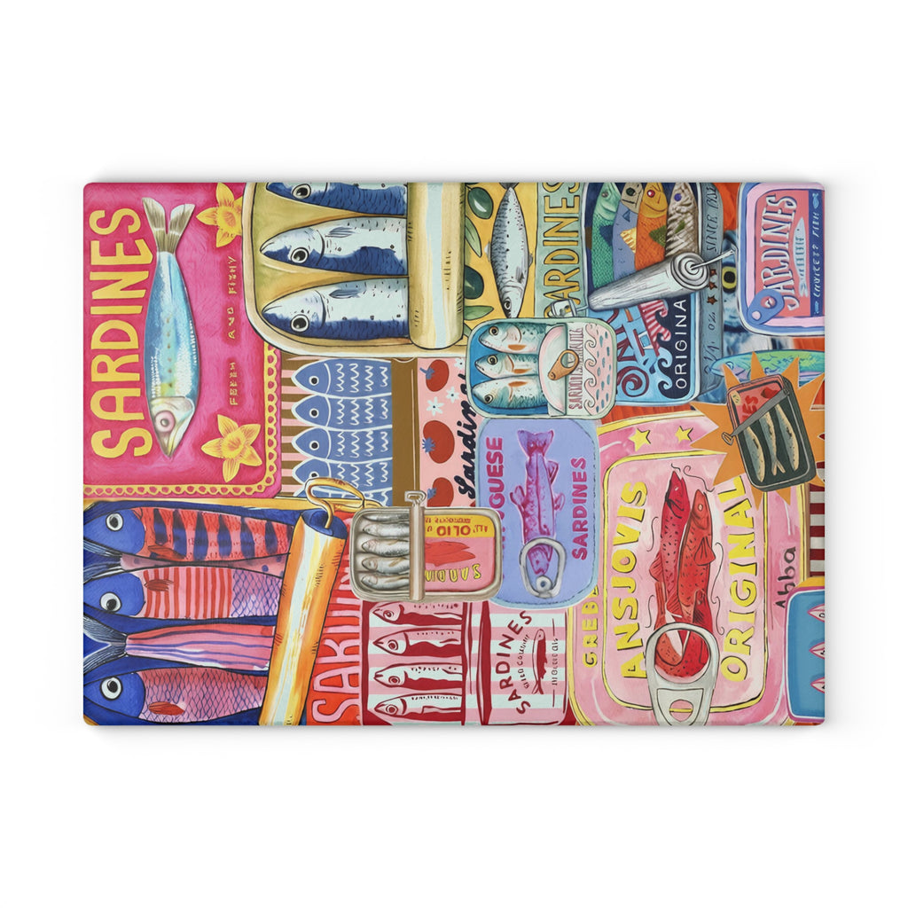 Close-up of colourful sardine illustrations and vintage Mediterranean details on glass cutting board
