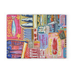 Close-up of colourful sardine illustrations and vintage Mediterranean details on glass cutting board