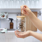 Stylish coffee social club glass cup displayed on kitchen countertop with iced latte.
