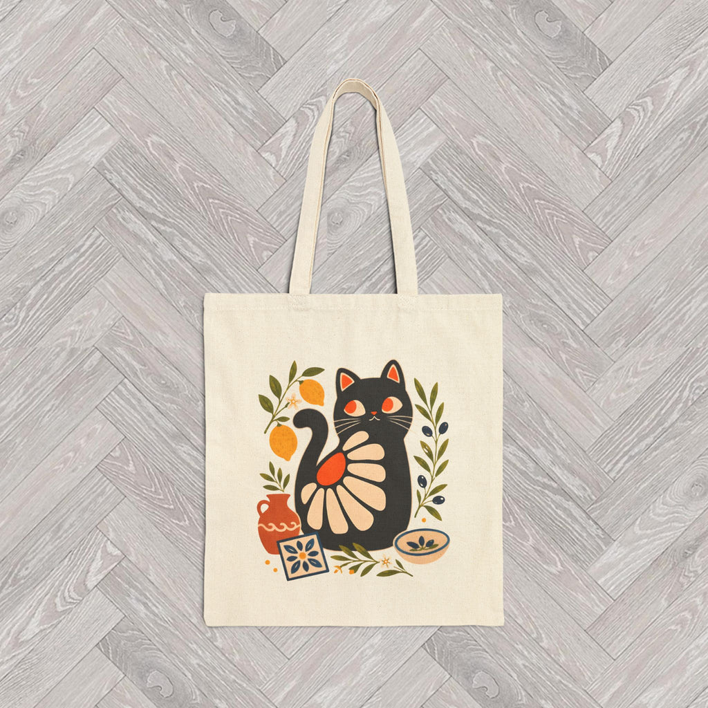 Eco-friendly canvas tote with whimsical black cat design, olive branches, lemons, and Mediterranean pottery accents.