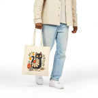 Artistic black cat tote bag with lemons, olives, terracotta vase, and Mediterranean decorative details.