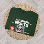 Close-up of the Horror Nights sweatshirt graphic showing bold Halloween Nights lettering and vintage-inspired horror movie artwork.