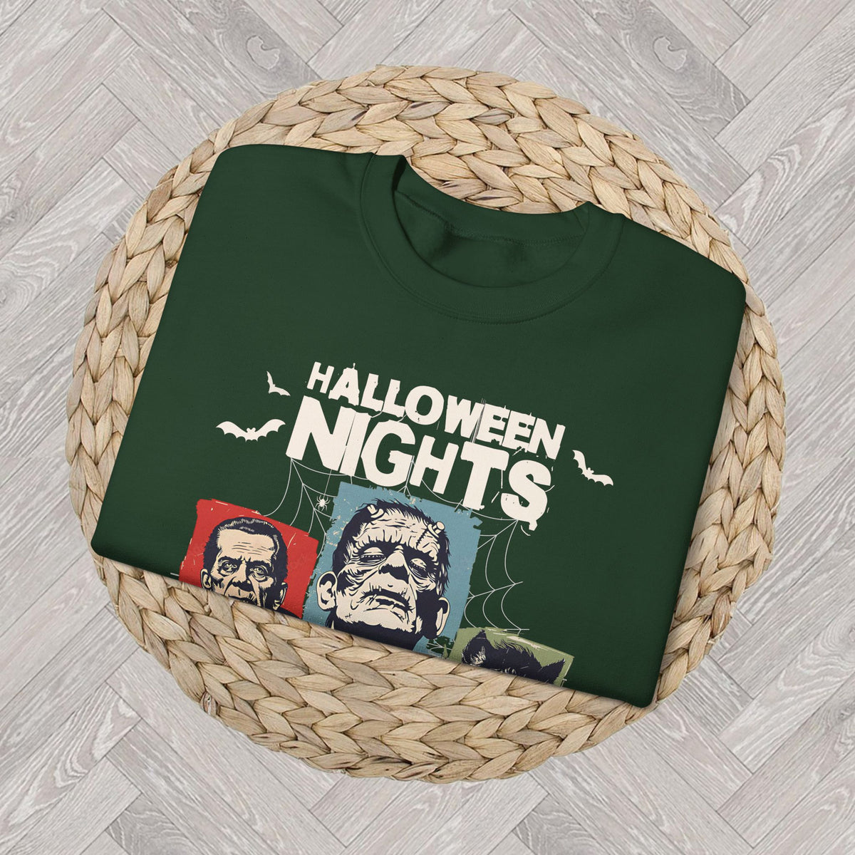 Close-up of the Horror Nights sweatshirt graphic showing bold Halloween Nights lettering and vintage-inspired horror movie artwork.