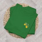 Folded Turf Green lemon embroidered tee highlighting the detailed citrus and green leaf embroidery