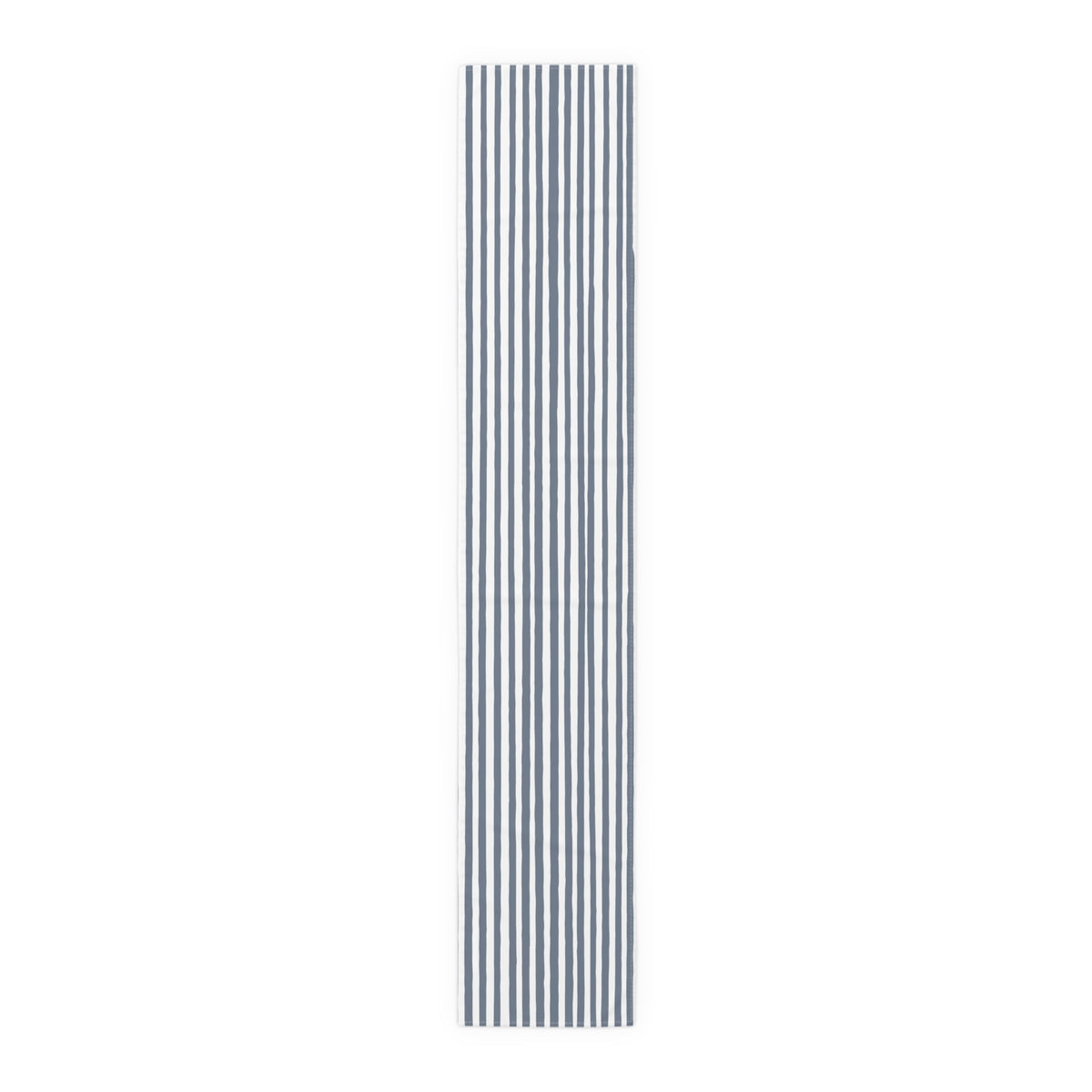 Modern dining table featuring a slate blue striped table runner.