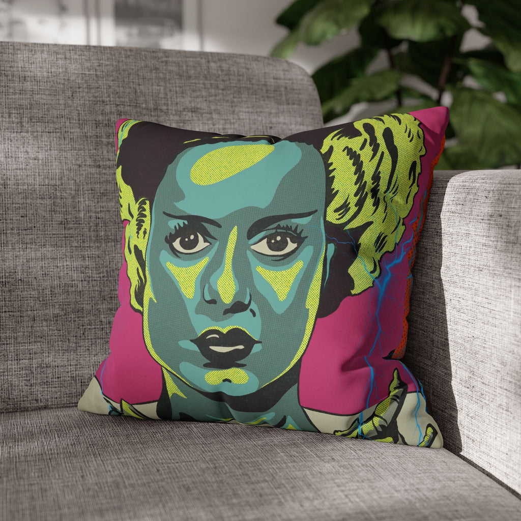 Frankenstein and Bride of Frankenstein pillow cover showing vibrant teal, lime, orange, red and magenta artwork