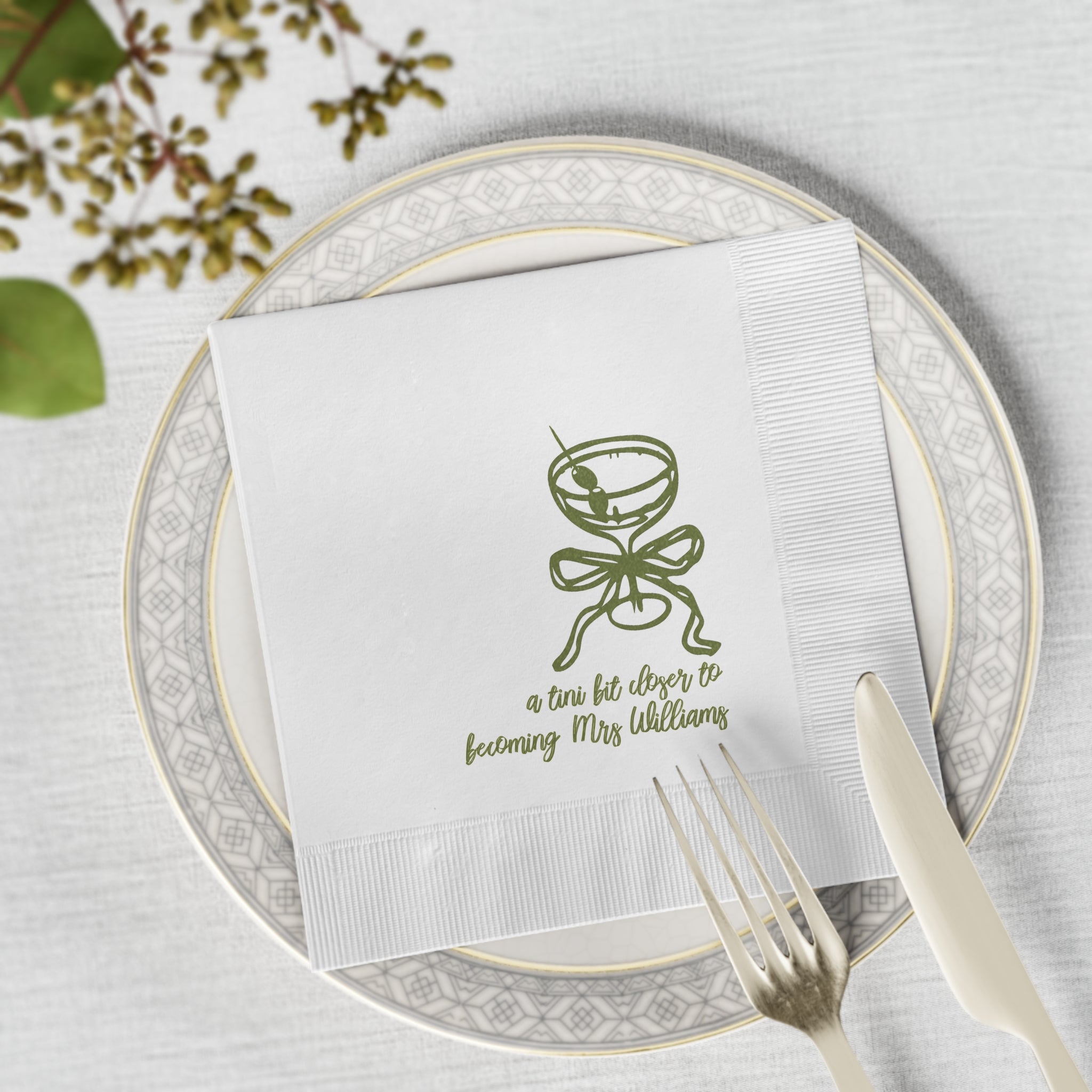 Custom bridal shower napkin featuring a modern martini illustration and personalized name for an elegant cocktail-themed celebration.