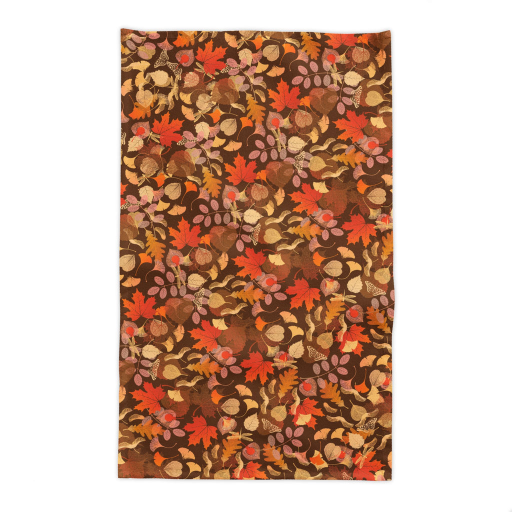 Nature inspired fall table decor featuring a botanical leaf print cotton tablecloth for Thanksgiving and autumn entertaining