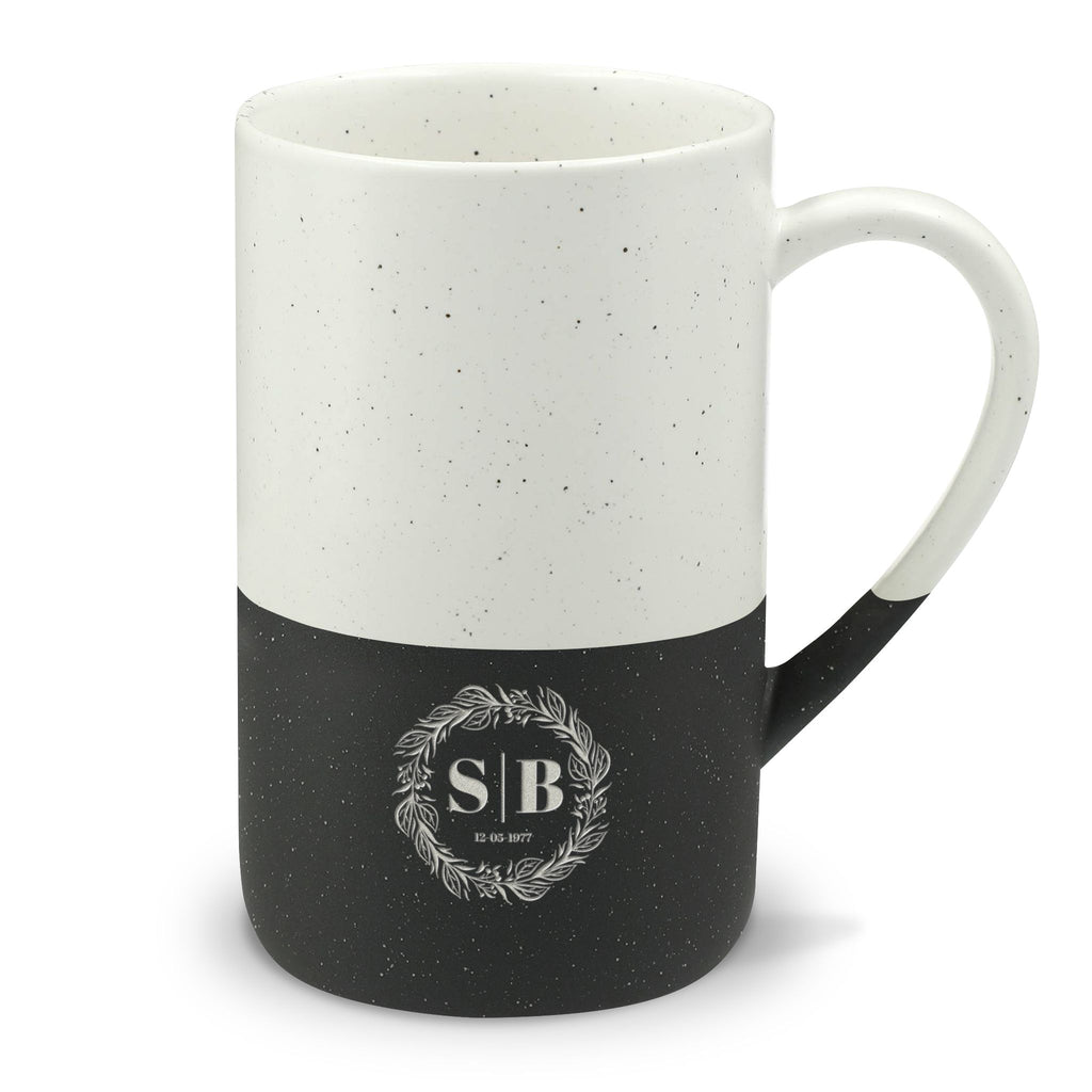 Close-up of the olive branch crest on a personalised ceramic mug, showcasing custom initials or name and memorable date.