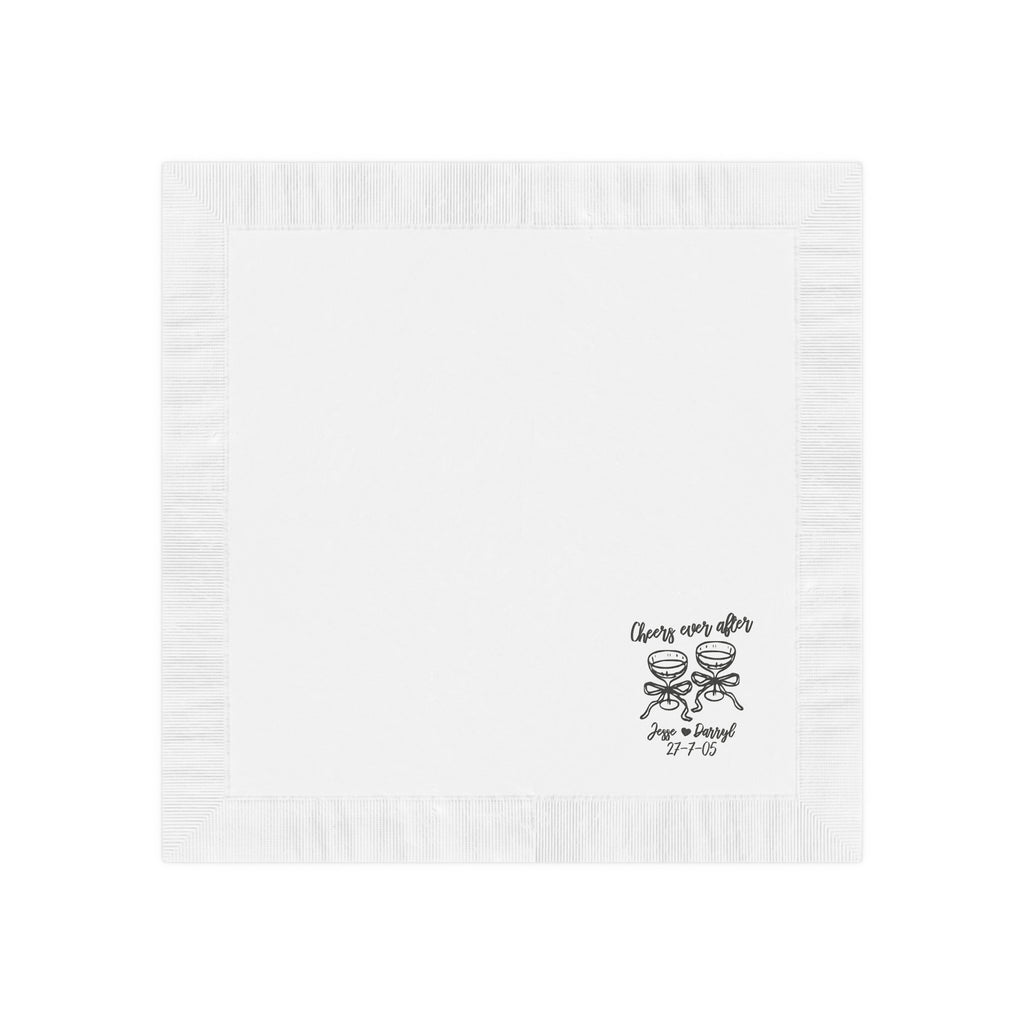 Close-up of a premium white coined-edge wedding napkin featuring a custom Cheers to Ever After design with cocktail glasses.