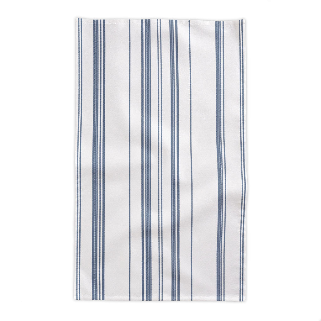 French Riviera Heritage Stripe Tablecloth displayed in a sophisticated dining setting with rustic furniture and Mediterranean farmhouse accents.