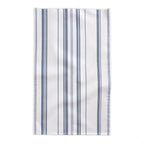 French Riviera Heritage Stripe Tablecloth displayed in a sophisticated dining setting with rustic furniture and Mediterranean farmhouse accents.