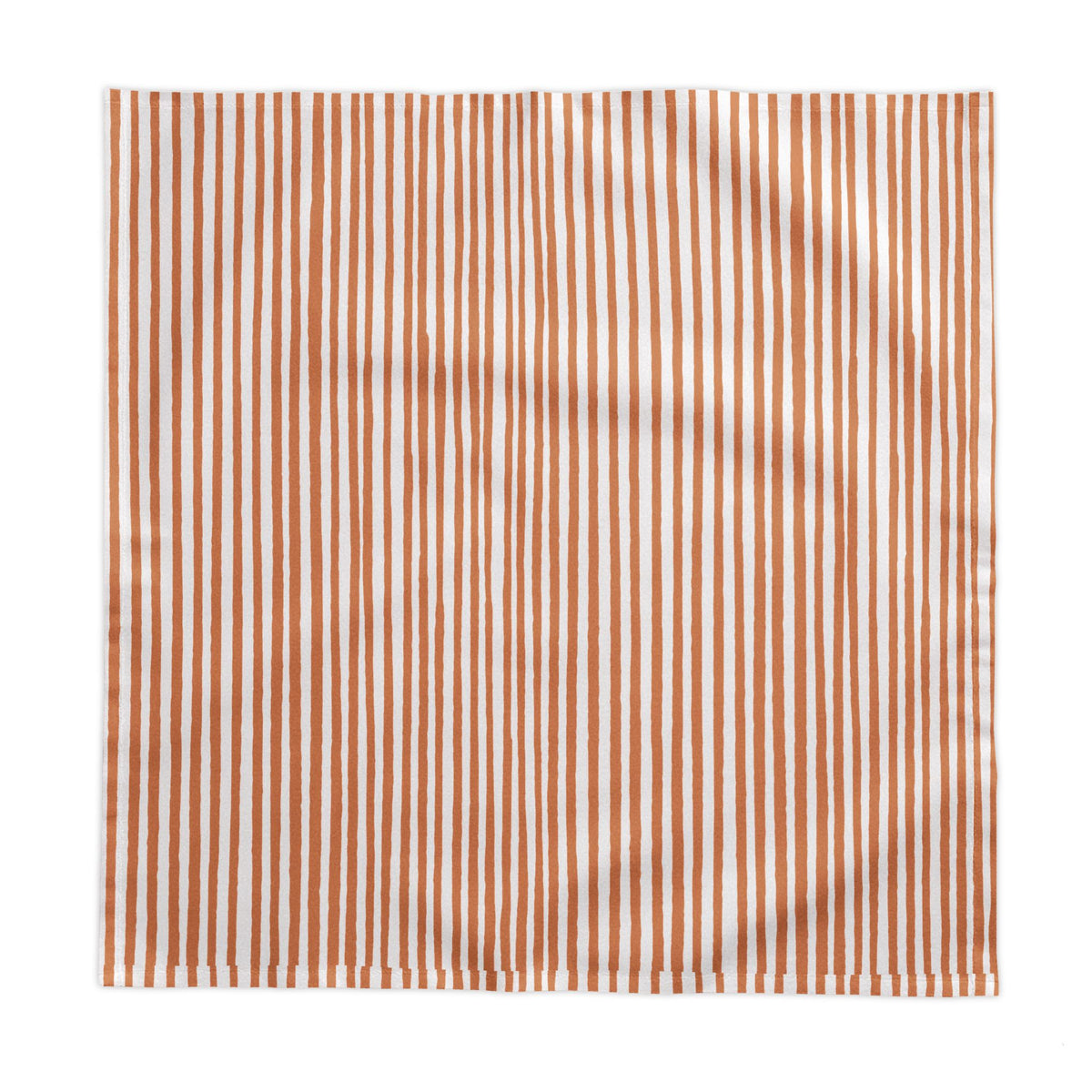 Soft terracotta and cream striped tablecloth paired with matching striped napkins and neutral ceramic tableware.