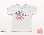 White personalized toddler birthday shirt with red pizza graphic and blue ‘Amelia is One’ text, Italian pizza party custom baby tee.