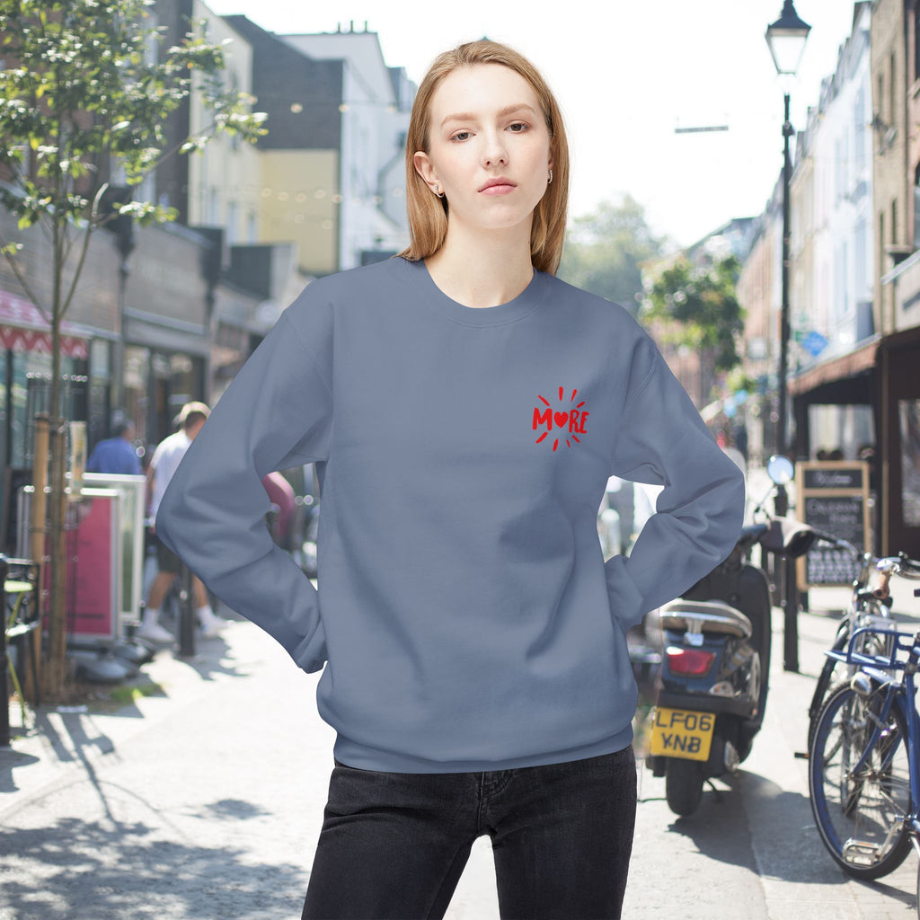 Front view of More Amore Por Favour colourful graphic sweatshirt in Stone Blue with a small upper left chest heart and colourful back artwork.