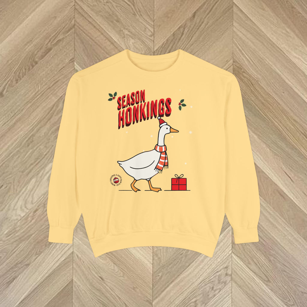 Playful Christmas sweatshirt featuring the Season Honkings goose design, perfect for relaxed festive outfits and Christmas gifting.