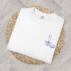 Front view of Oyster and Champagne graphic t-shirt styled with relaxed coastal aesthetic outfit
