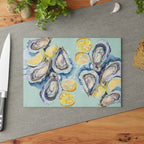 Textured tempered glass cutting board with watercolor oyster artwork and lemon illustrations for coastal home decor
