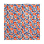 Modern Mediterranean dining décor featuring a blue coral reef cotton twill tablecloth with vibrant botanical motifs.