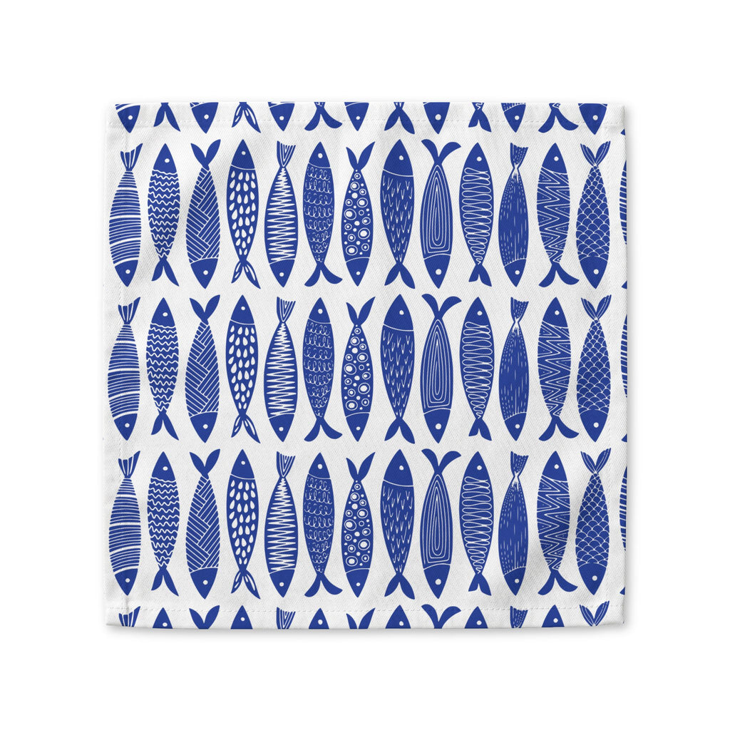 Blue fish cotton napkin available in 10x10 inch and 22x22 inch sizes for coastal dining and dinner parties