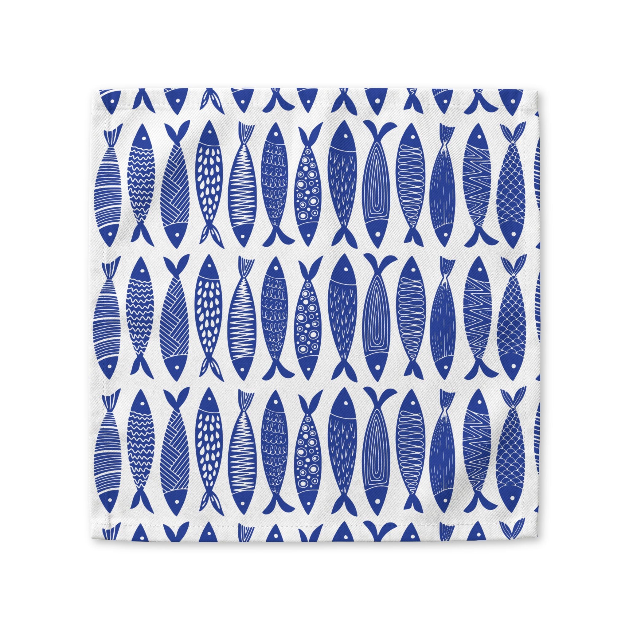Blue fish cotton napkin available in 10x10 inch and 22x22 inch sizes for coastal dining and dinner parties