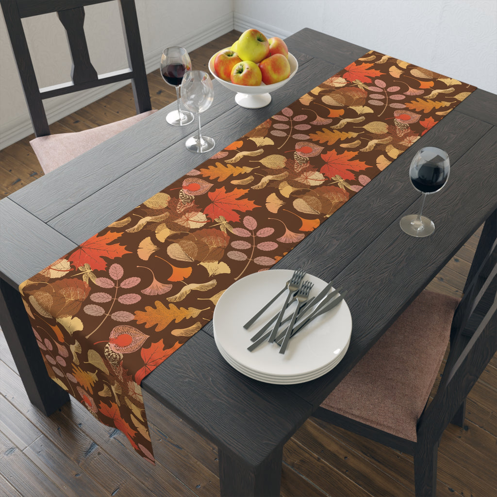 Polyester finished 16 by 72 inch fall leaves table runner styled on a smaller dining table