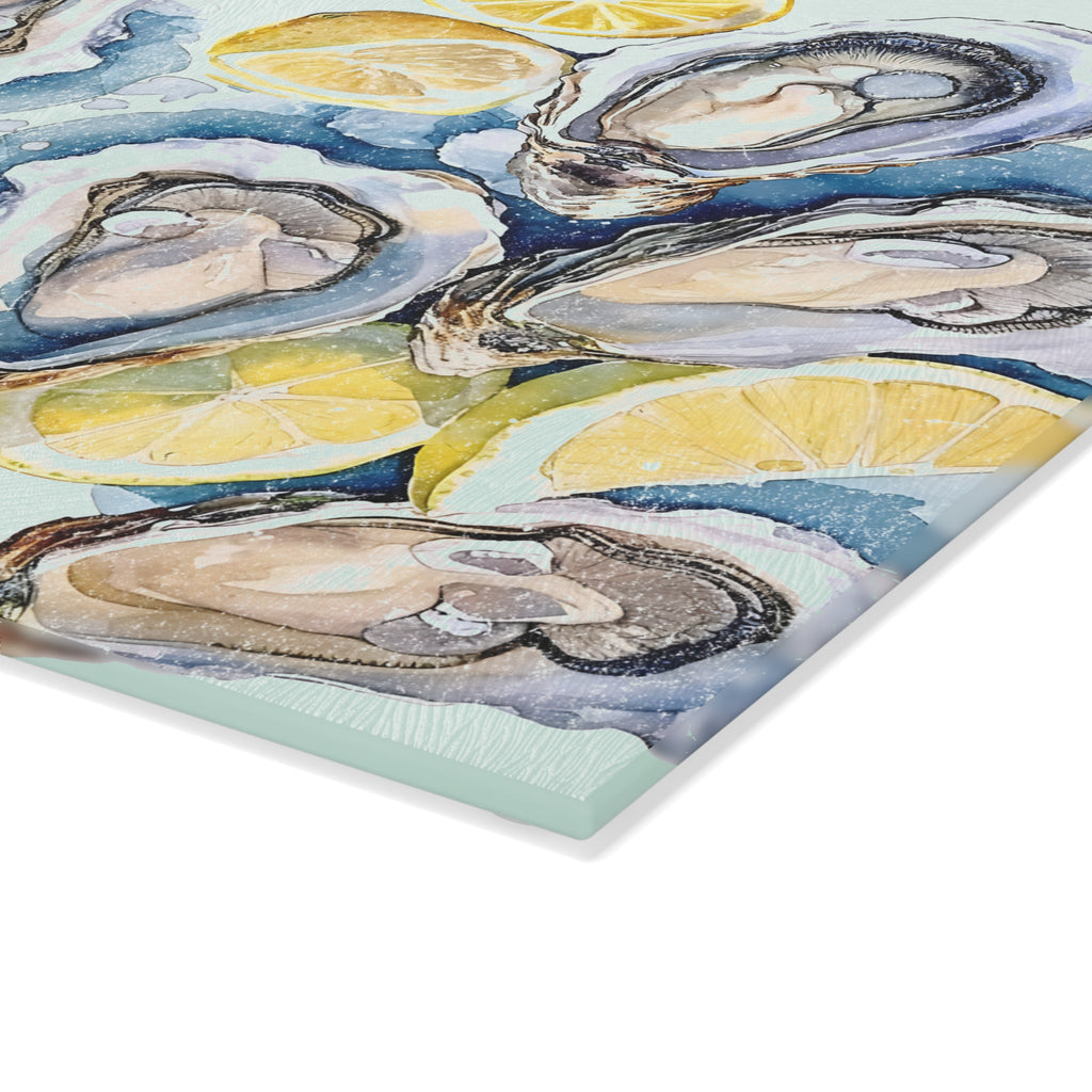 Close-up view of watercolor oyster shells and fresh lemon slices design on a decorative glass cutting board