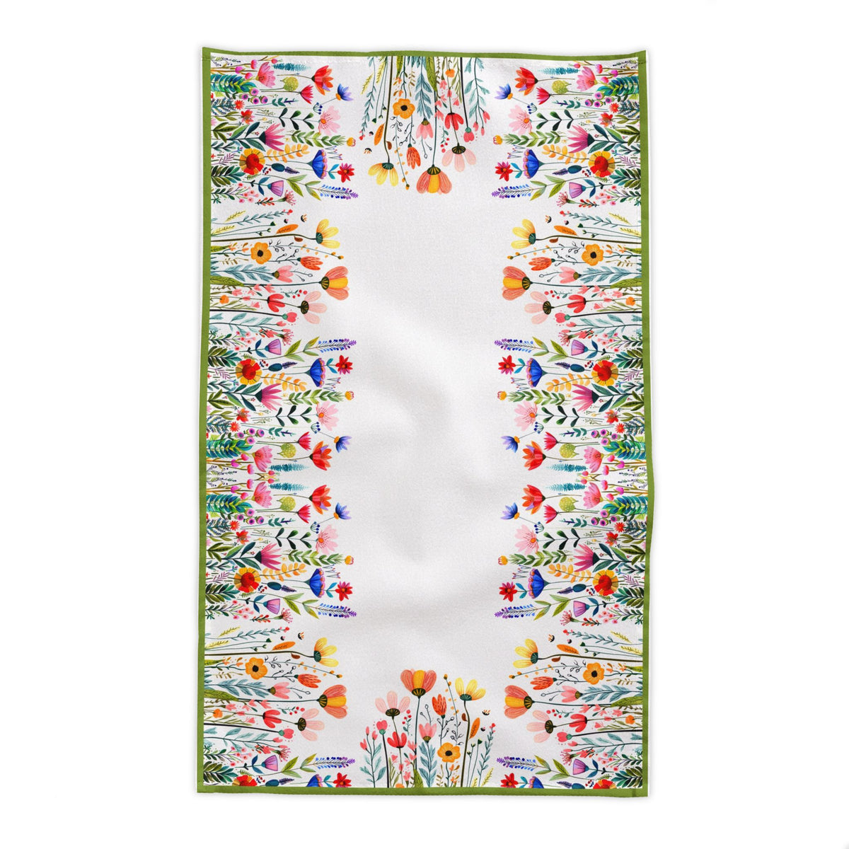 European summer inspired dining scene featuring Mediterranean botanical tablecloth with flowers, ceramics, and natural décor