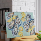 Watercolor oysters and lemon serving board displayed as colourful coastal kitchen artwork and entertaining decor