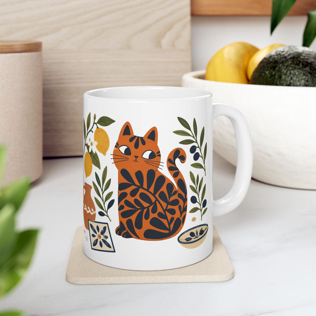 Mediterranean Matisse Cat ceramic mug featuring a playful red cat surrounded by lemons, olive branches, and artisan tile details.