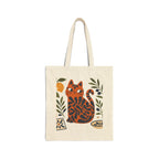 Artistic Mediterranean cat canvas tote bag with vibrant orange cat illustration surrounded by olive branches and lemons.
