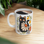 Mediterranean inspired ceramic mug with stylised black cat and citrus botanical illustration