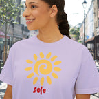 Close-up of the T-shirt’s golden sun graphic with the hand-lettered word “sole” printed beneath it.